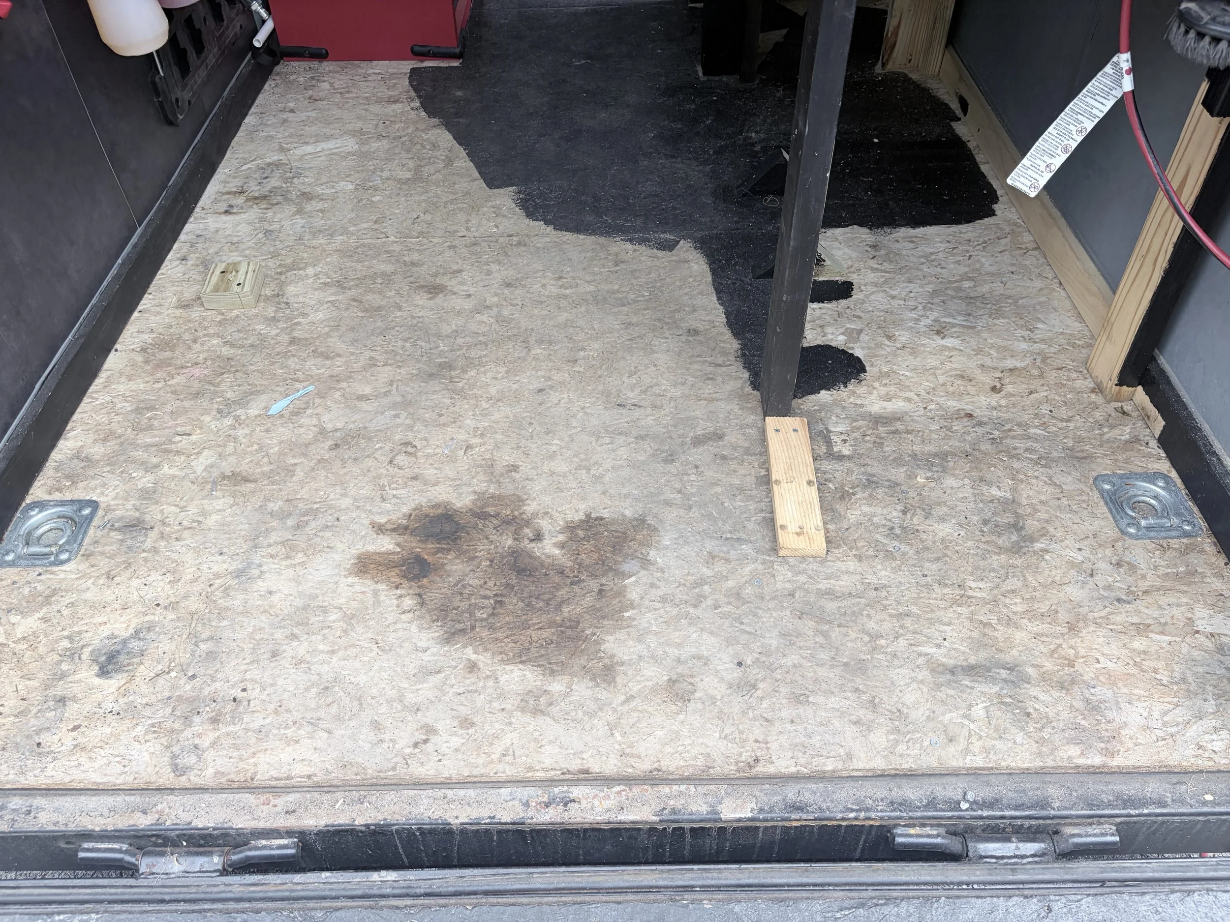 Before photo of trailer with previous failing coating.