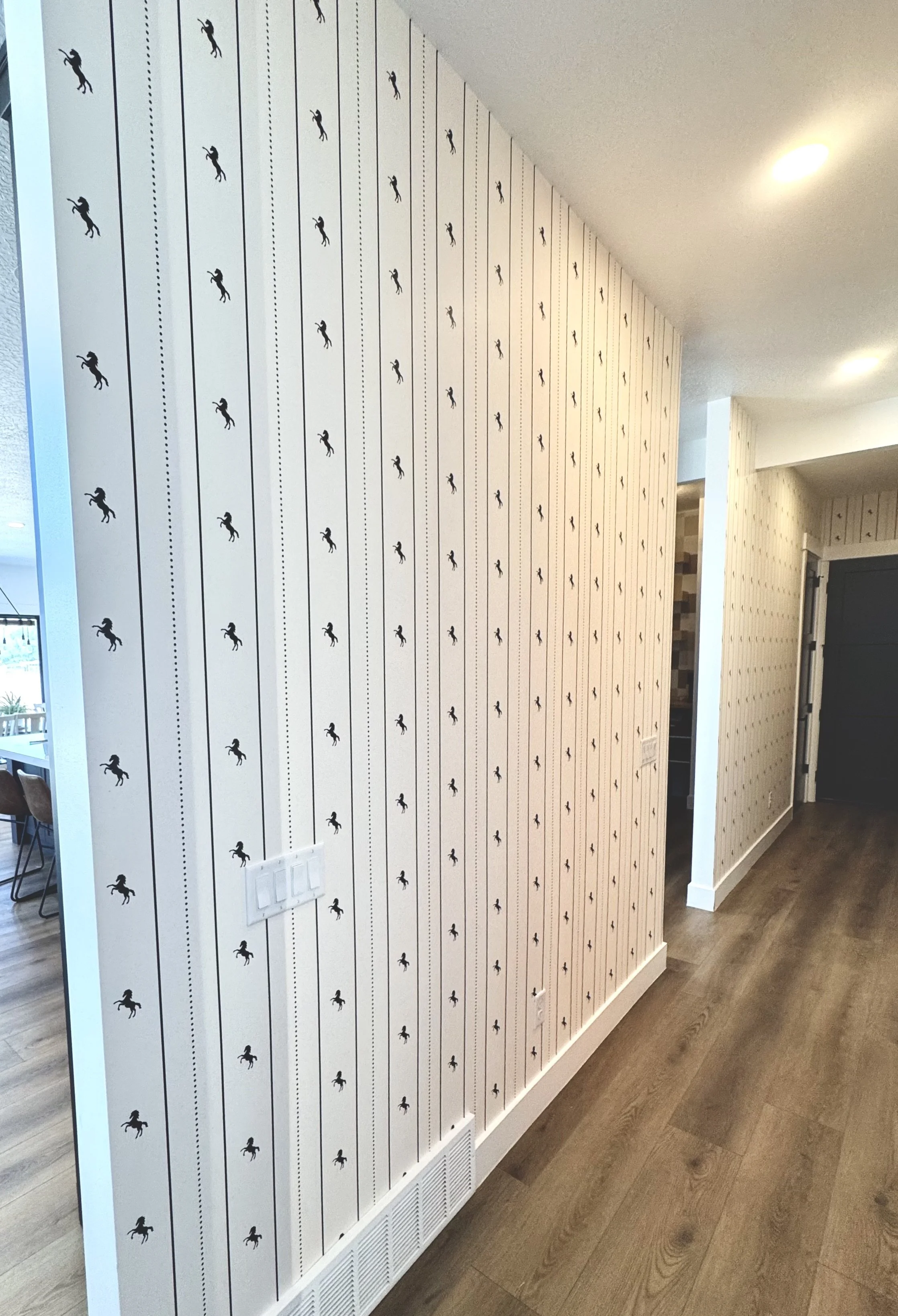 I'm Not Too Western Green Horse Wallpaper by The Torrie Jarrett Line Wall Blush wallpaper installation in a hallway with black interior doors