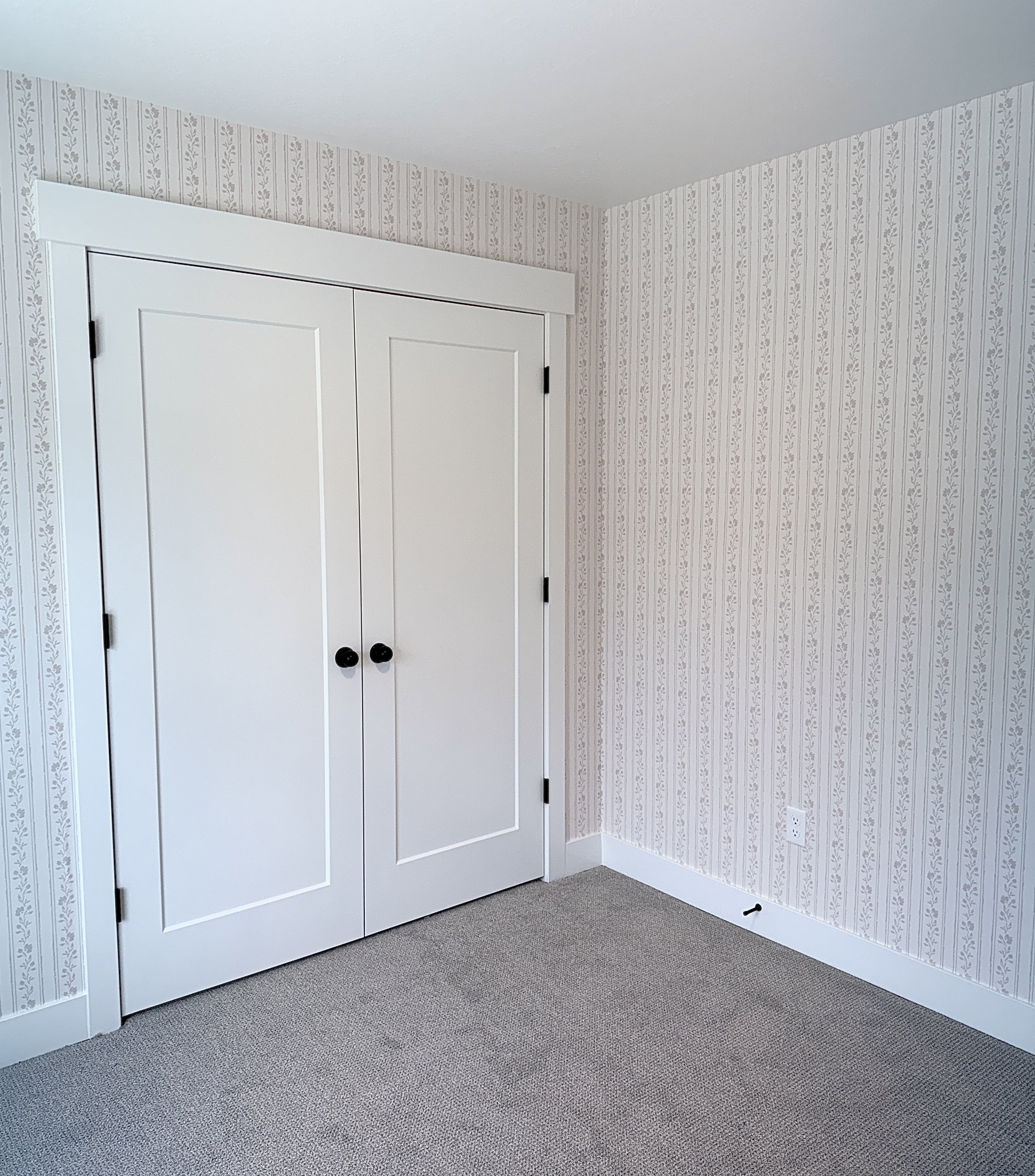 Soft blush pink floral striped wallpaper for baby girl nursery.