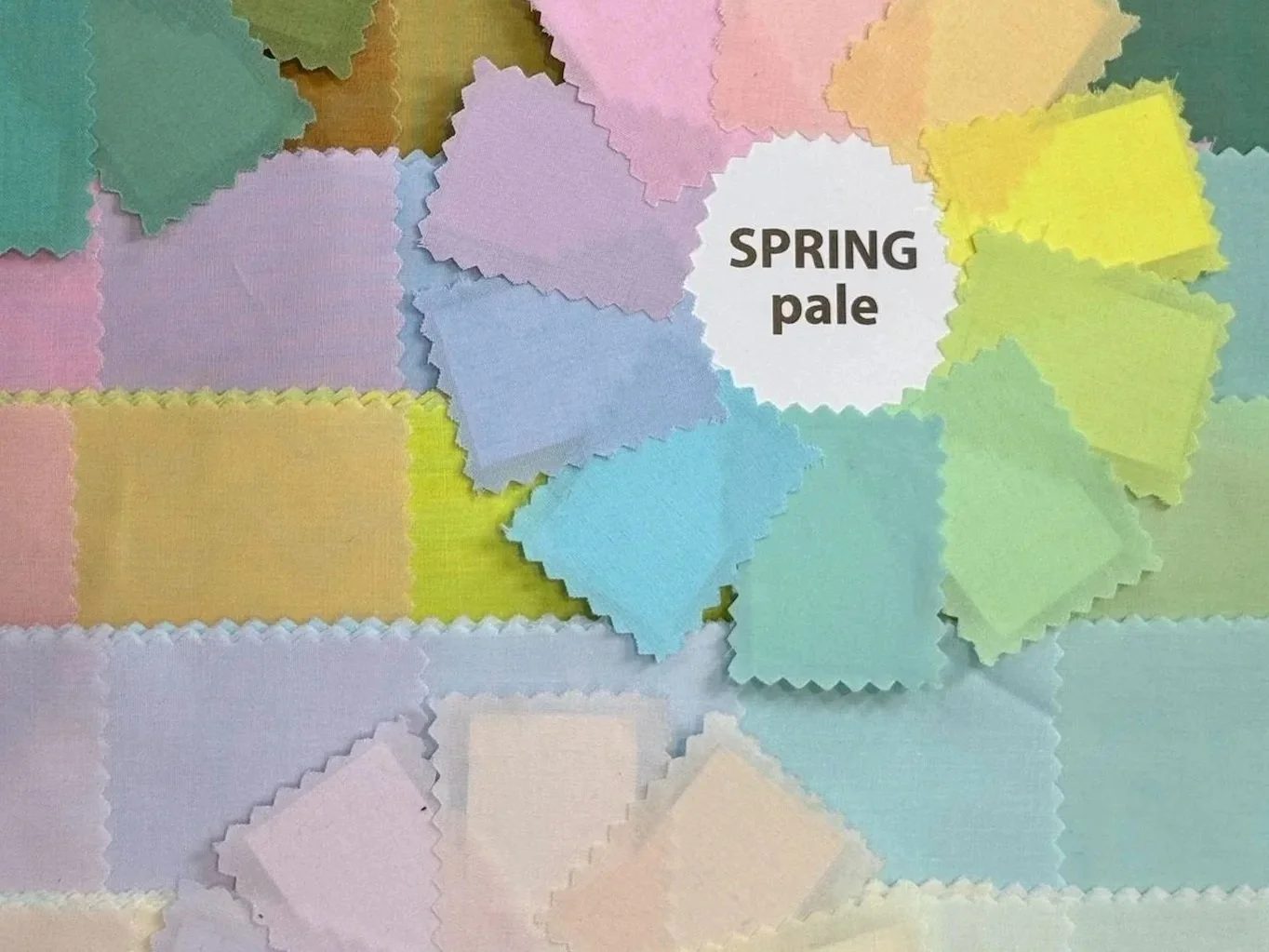 Color swatches arranged with a label that says 'Spring pale' indicating pastel and light shades typical for spring fashion.