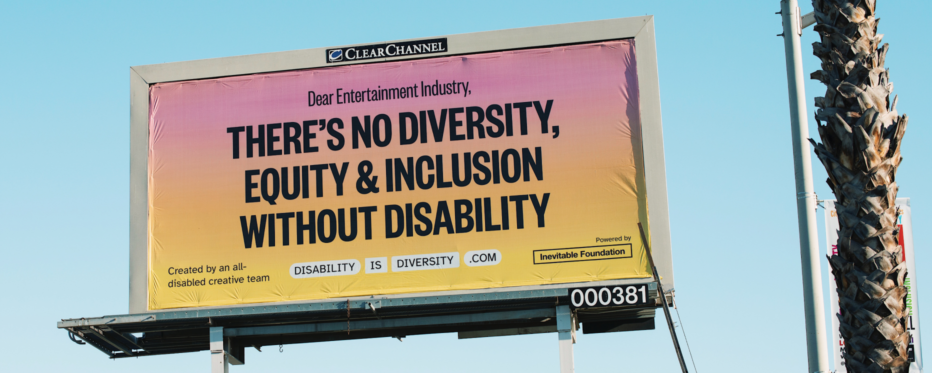 Billboard with a pink to yellow gradient background displays a message addressing the entertainment industry about diversity, equity, and inclusion, sponsored by the Inevitable Foundation.
