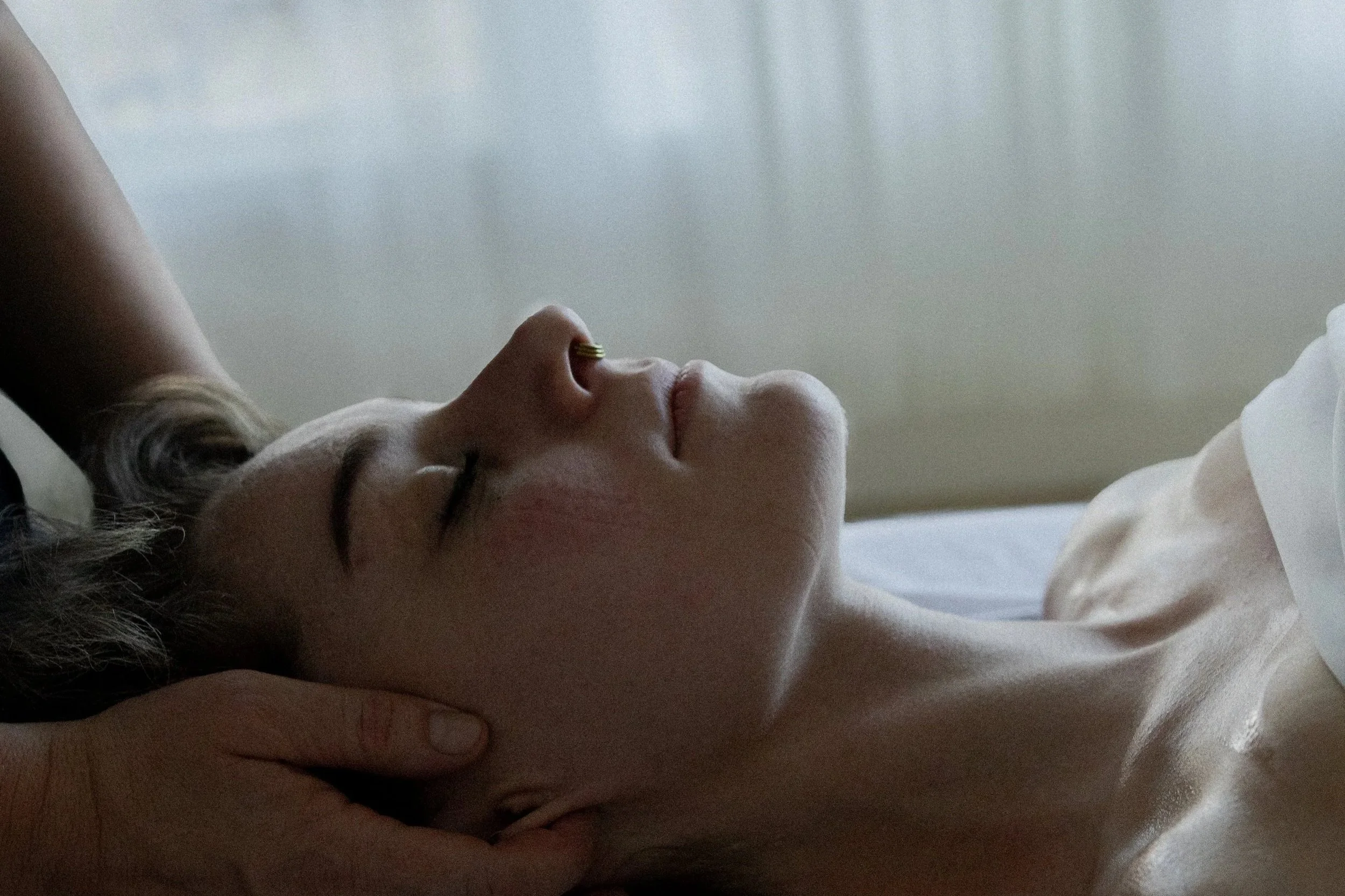 Jessie Gunther giving a neck massage to a client