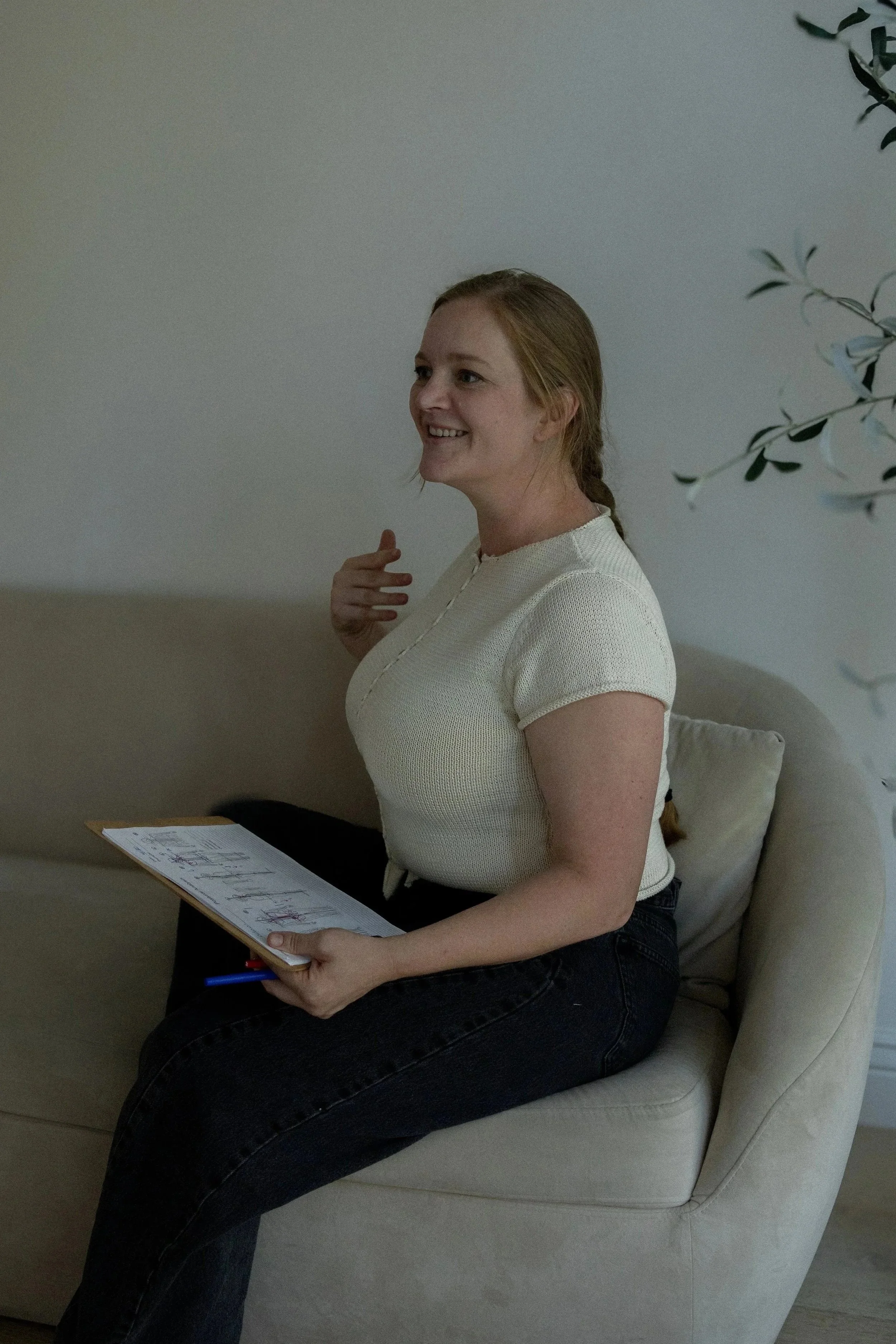 Jessie Gunther assessing a client's chart and coming up with a treatment plan