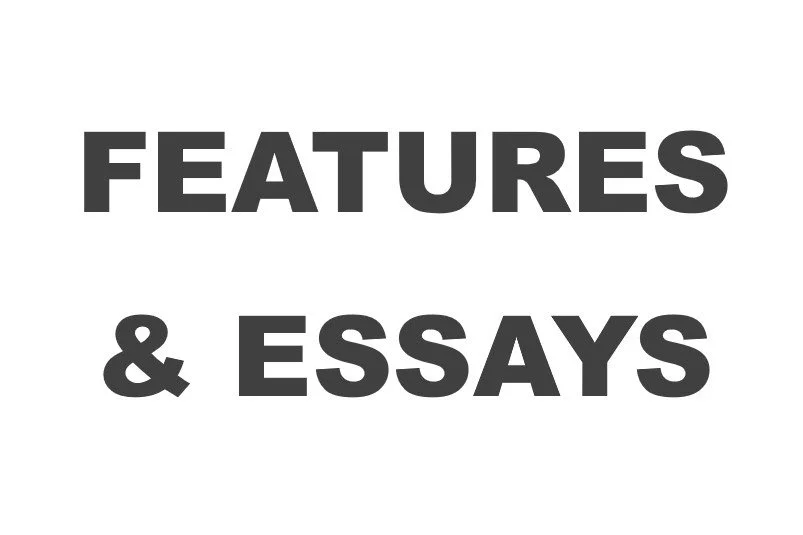 Black and white text reading 'Features & Essays' on a plain background.