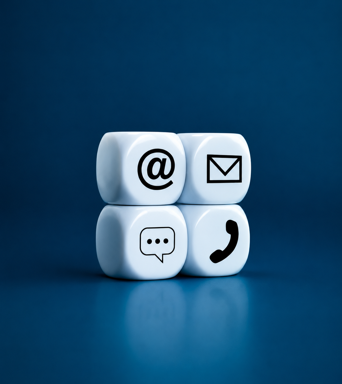 Four white cubes with black icons representing email, message, and phone, arranged in a 2x2 grid on a dark blue background.
