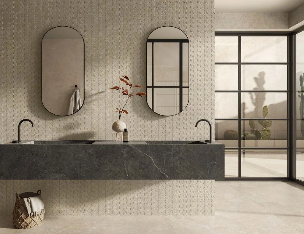 Sophisticated bathroom featuring Impronta Limestone Beige porcelain slabs on walls and floors, complemented by a textured Foglie mosaic design feature wall, supplied and installed by PietraCasa.