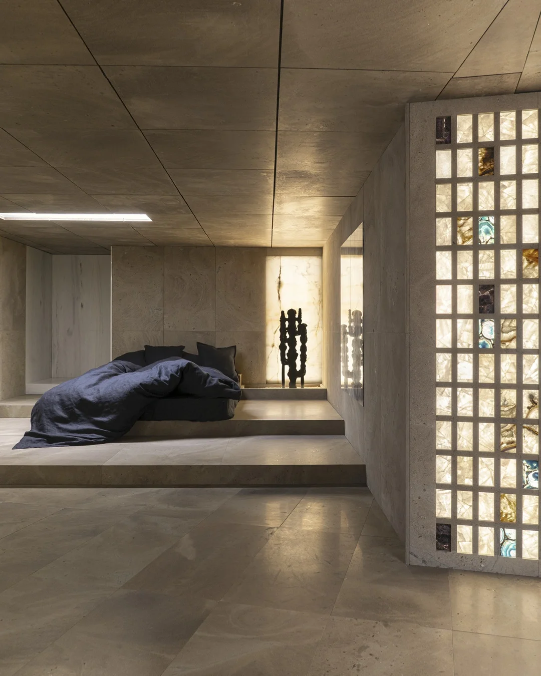 Subterranean bedroom from 'La Casa di Marmo,' an architectural installation designed by Hannes Peer Architecture in collaboration with Margraf, supplied by PietraCasa.