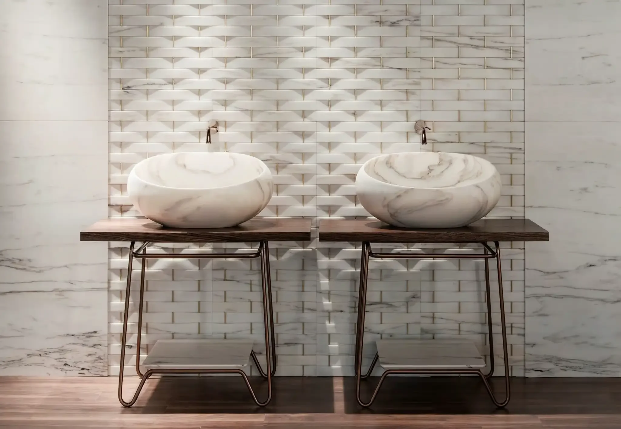 A luxurious double vanity setup featuring Kreoo Gong countertop washbasins, crafted from solid carved marble and designed by Enzo Berti, resting on bespoke dark wood and metal consoles, available through PietraCasa.