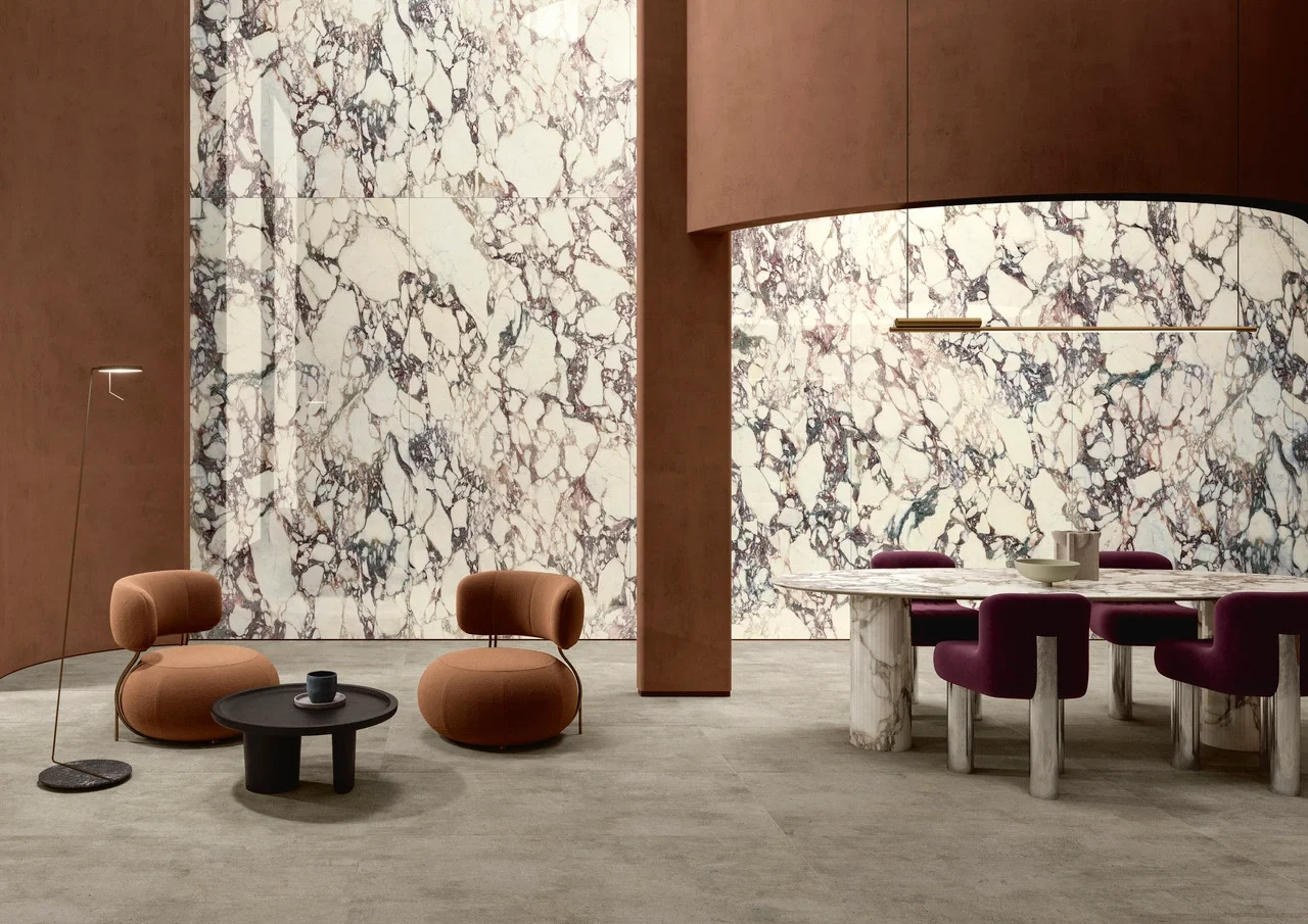 Luxury modern interior featuring dramatic Ariostea Calacatta Viola marble-effect porcelain stoneware slabs, supplied and installed nationwide by PietraCasa.