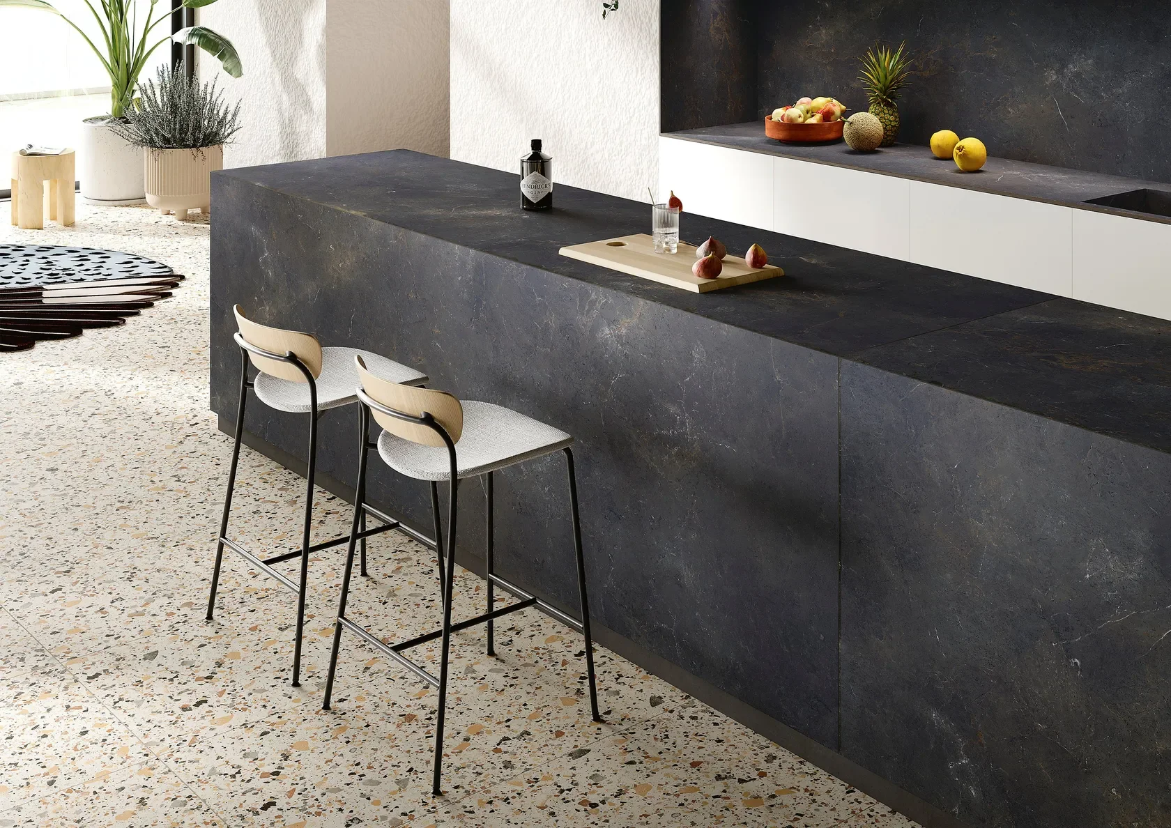 Kitchen island and backsplash clad in SapienStone Black Diamond, a premium Italian porcelain surface, supplied by PietraCasa.