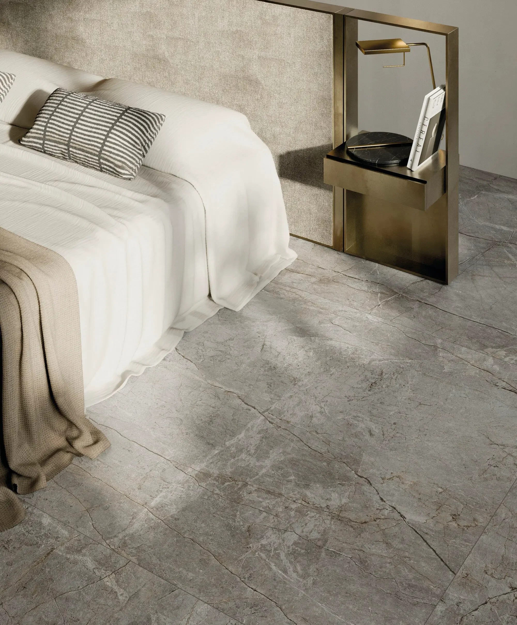 Modern bedroom featuring Fiandre Silver Root porcelain stoneware flooring, which provides a refined, tactile aesthetic with its shaded silvery background and intricate graining, expertly supplied and installed by PietraCasa.