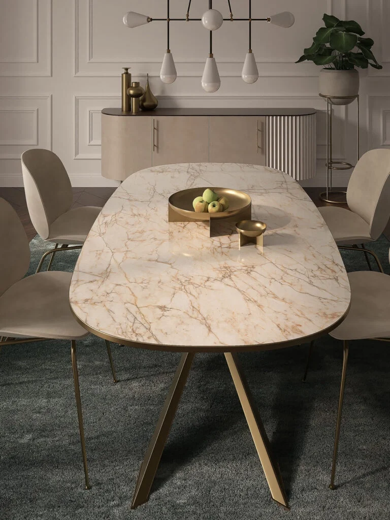 A dining room featuring a minimalist table with a Laminam porcelain surface, complemented by modern neutral furniture and elegant lighting, available through PietraCasa.