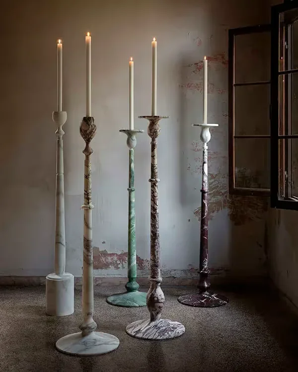 The Treasure candlesticks by Italian brand Kreoo, designed by Christophe Pillet, featuring elegant marble construction, available through PietraCasa.
