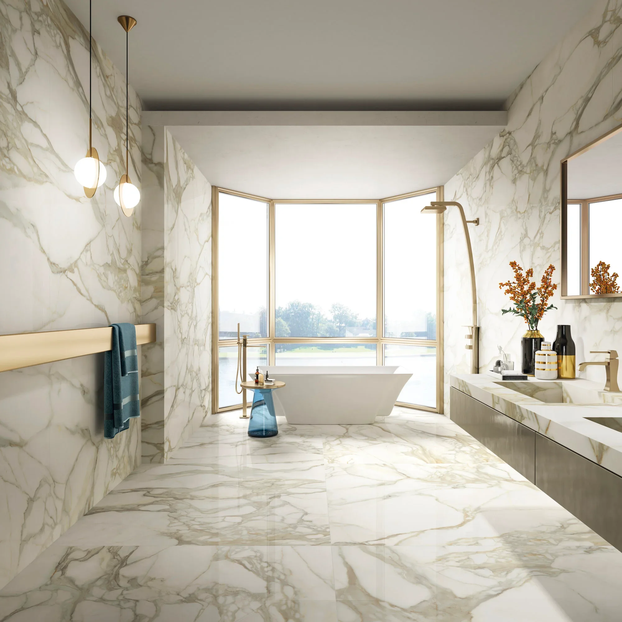 Luxurious bathroom interior featuring Maxfine Marmi Calacatta Oro premium marble-effect porcelain tiles by Italian brand FMG Fabbrica Marmi e Graniti, expertly supplied and installed by PietraCasa.