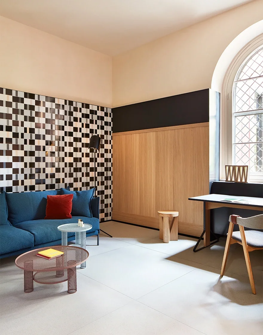 The Casa Mutina Milano showroom interior, featuring ceramic installations and design by Patricia Urquiola, showcasing high-end contemporary aesthetics, available through PietraCasa.