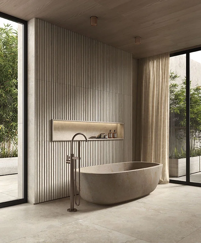 A Japandi-style bathroom curated by Kronos Ceramiche, highlighting a total look in premium porcelain stoneware, available through PietraCasa.