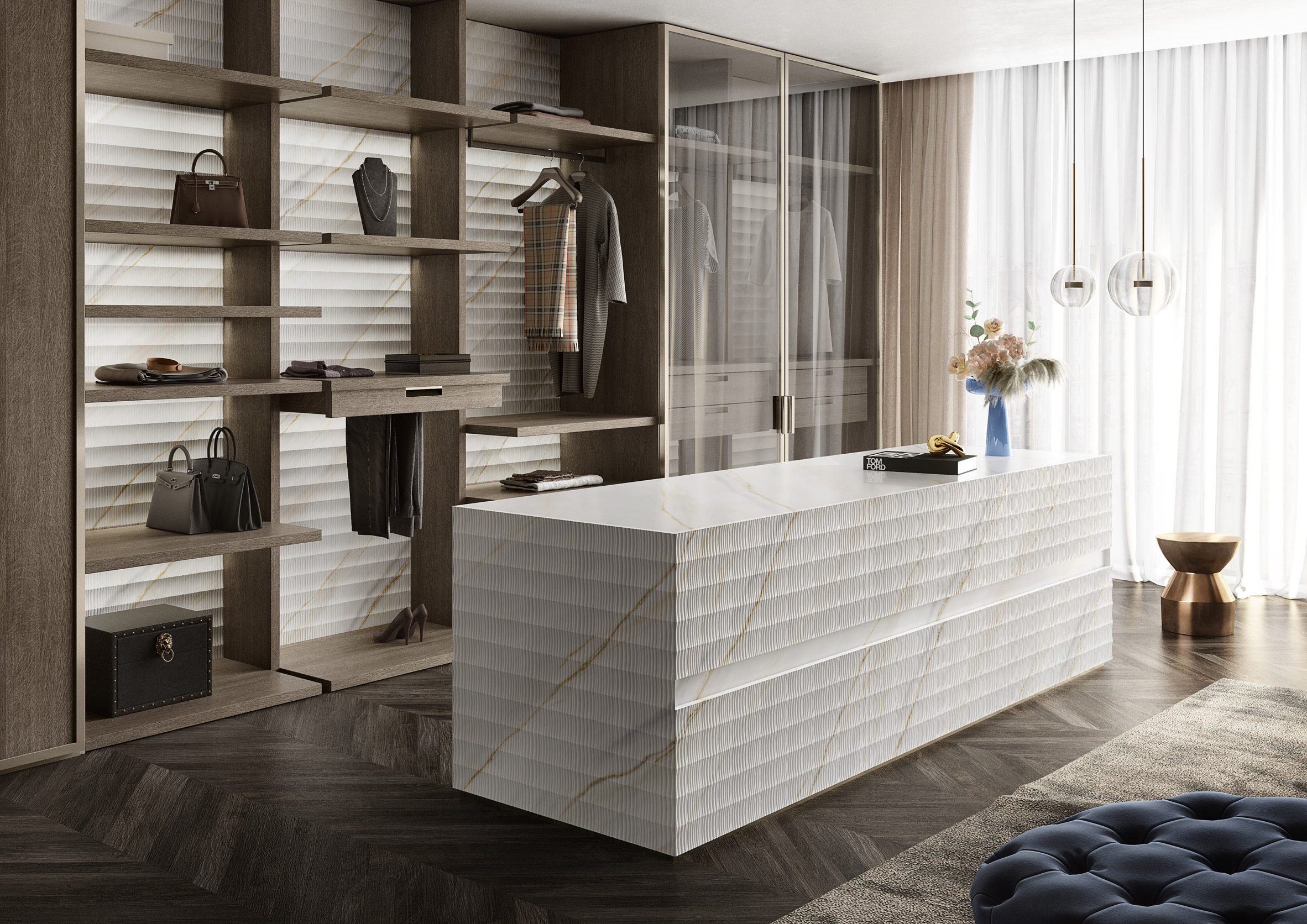 Luxury walk-in closet featuring a central island clad in a textured, linear-patterned marble from the Antolini Textures+ Collection, supplied by PietraCasa.