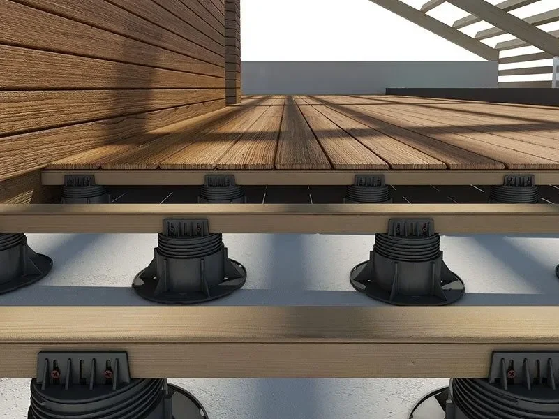Close-up of Eterno Ivica adjustable plastic pedestal supports used for creating professional elevated decking systems, supplied and installed by PietraCasa.