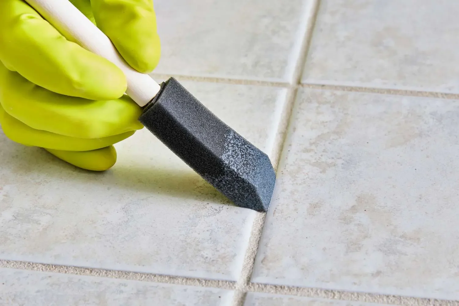 Professional application of grout sealer on tiled flooring using the Cercol maintenance system, supplied by PietraCasa.