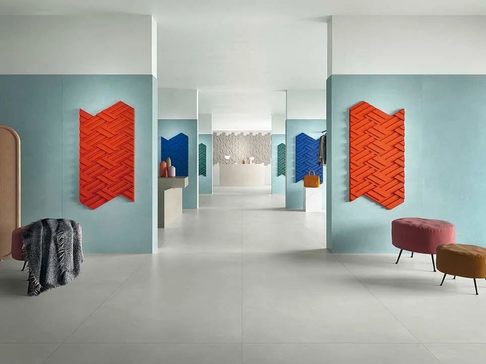 Vibrant retail interior featuring the Rilievi collection by CEDIT - Florim Ceramiche, showcasing decorative ceramic wall panels in bold colors, supplied and installed nationwide by PietraCasa.