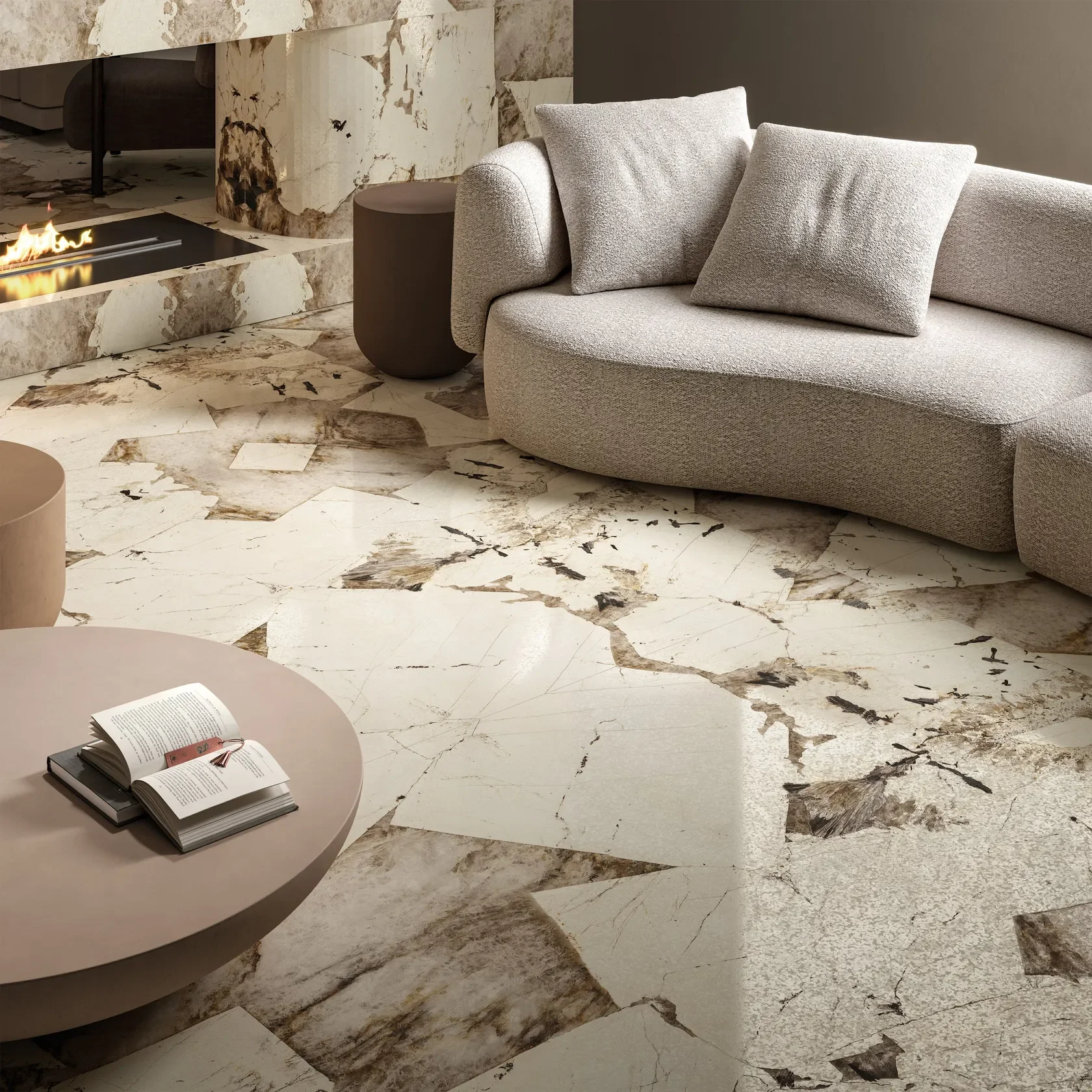 Luxurious living space featuring FMG Patagonia porcelain slabs from the Marmi MaxFine collection, used for elegant fireplace cladding and flooring, expertly supplied and installed by PietraCasa.