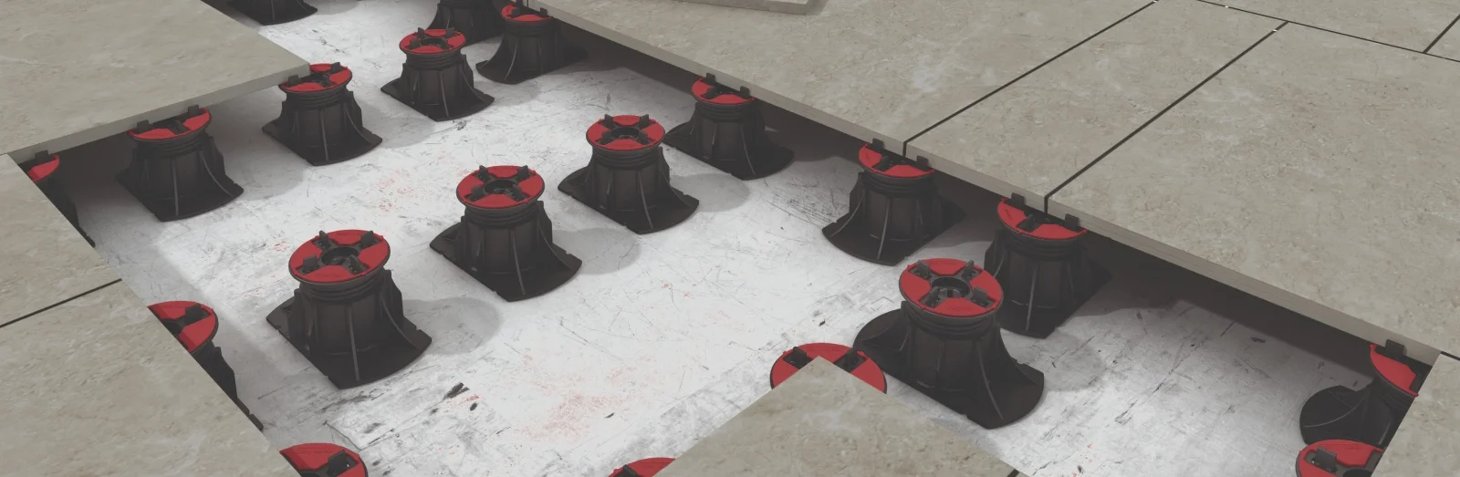 Detailed view of Eterno Ivica adjustable pedestals with integrated spacing tabs for precision tile alignment, professionally supplied and installed by PietraCasa.