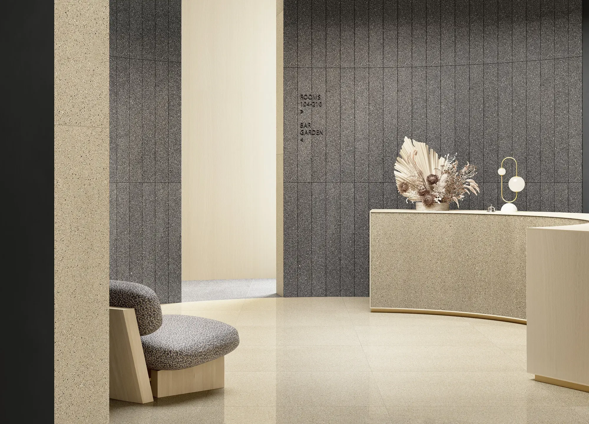 Commercial lobby interior featuring walls and surfaces clad in premium tiles from the Il Veneziano collection by Fiandre Architectural Surfaces, expertly supplied and installed by PietraCasa.