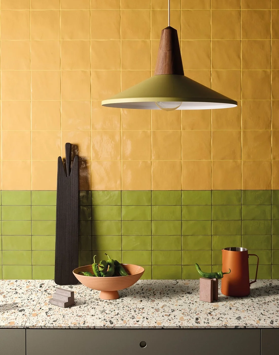 Vibrant kitchen wall featuring Iris Ceramica's Bottega d'Arte glossy tiles from the Terre and TerreLucide collections, showcasing an artisanal, handmade, tactile look, available through PietraCasa.