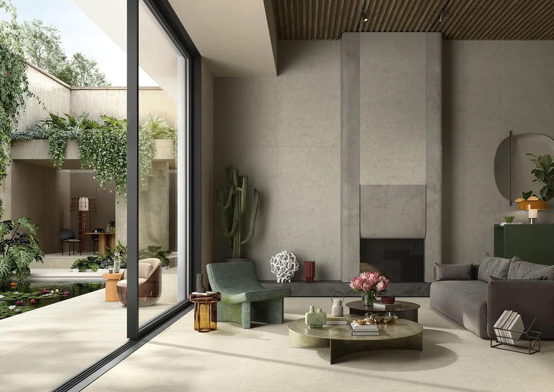 A contemporary indoor-outdoor living space featuring porcelain stoneware surfaces from Lea Ceramiche, an Italian brand renowned for blending architectural design with natural textures, available through PietraCasa.