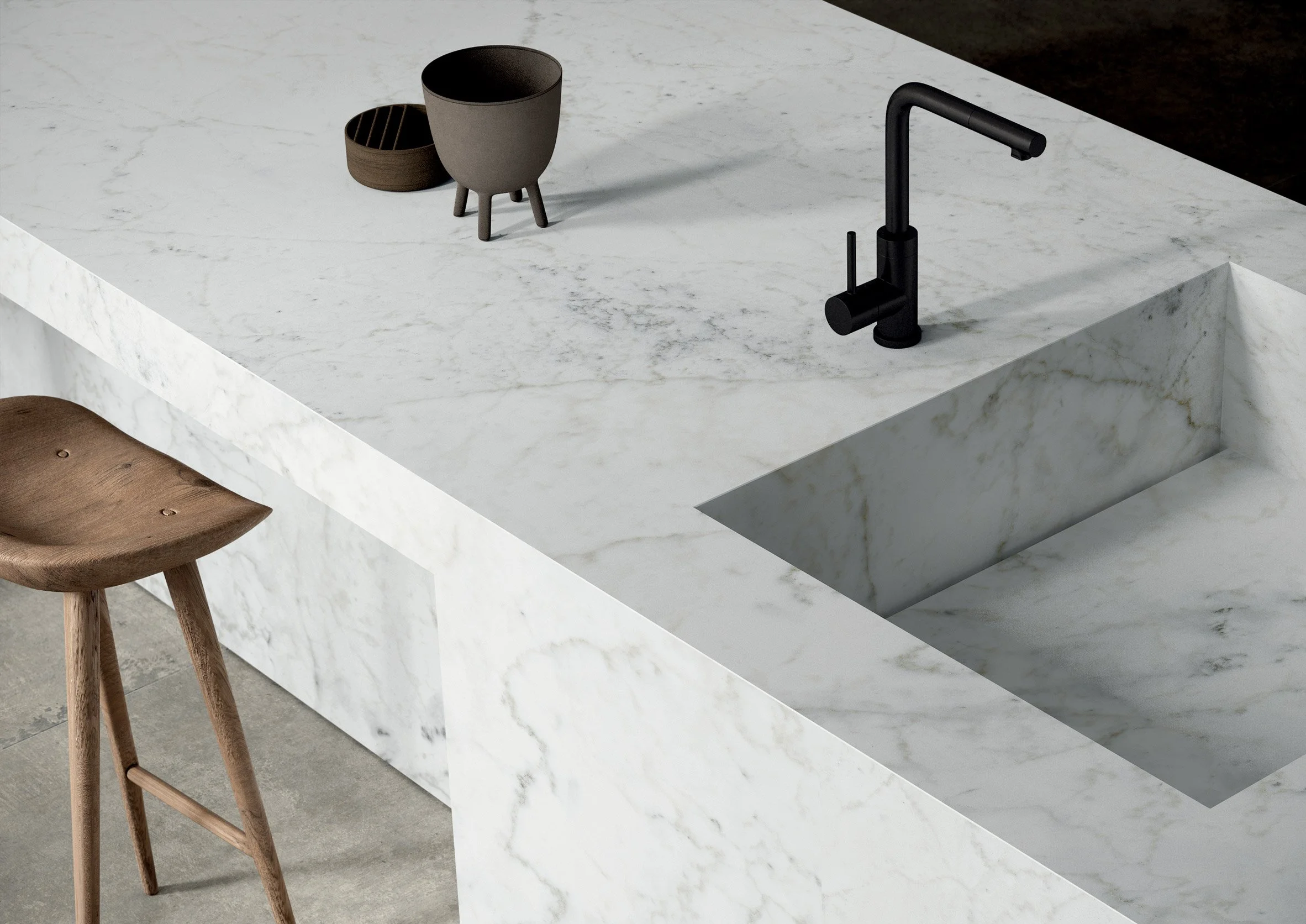 Modern kitchen featuring a bespoke worktop and integrated sink crafted from Ariostea Michelangelo Altissimo porcelain slabs, resembling Italian Carrara marble, supplied and installed nationwide by PietraCasa.