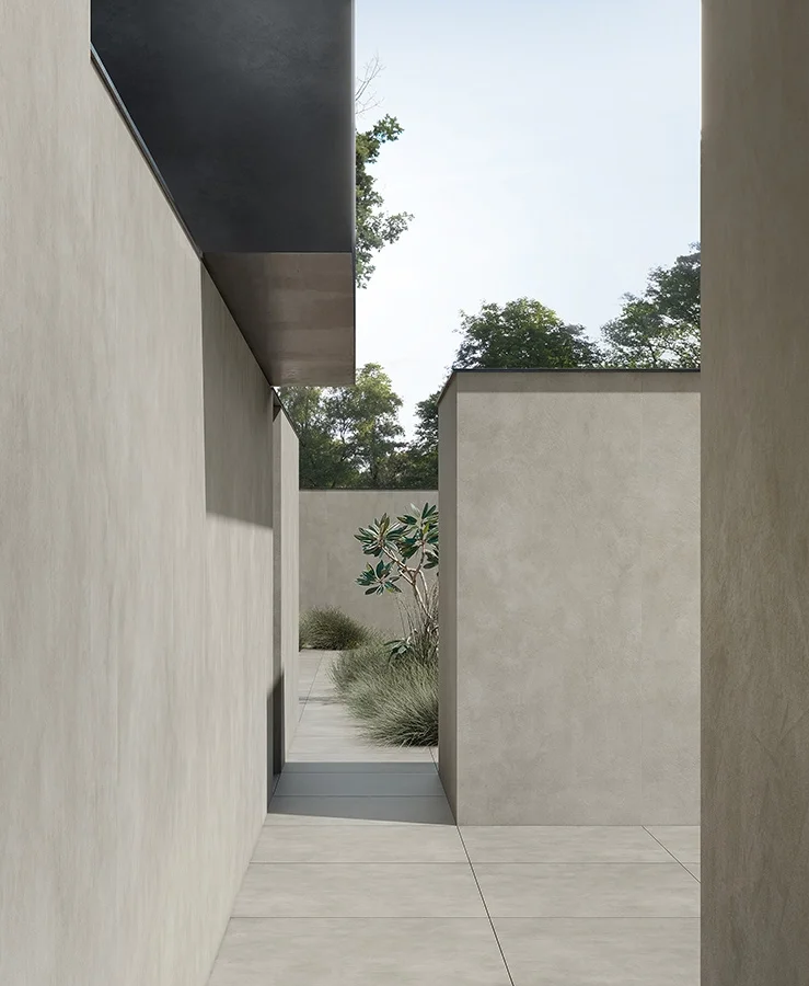 An architectural outdoor space showcasing the Materia collection by the Italian porcelain manufacturer Kronos Ceramiche, available through PietraCasa.