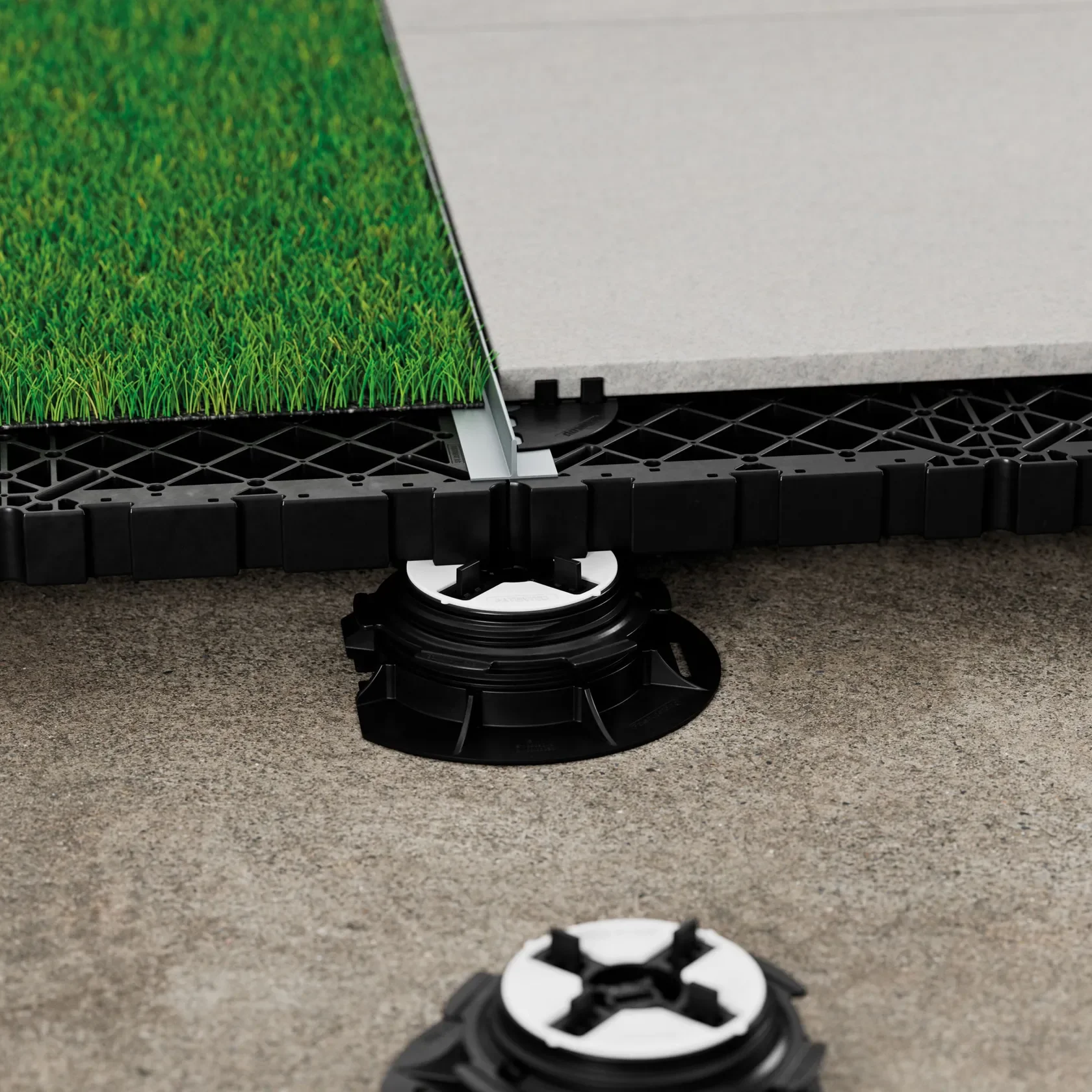 Close-up view of the Eterno Ivica GRF system, demonstrating its capability to create seamless, high-performance raised outdoor flooring, professionally supplied and installed by PietraCasa.