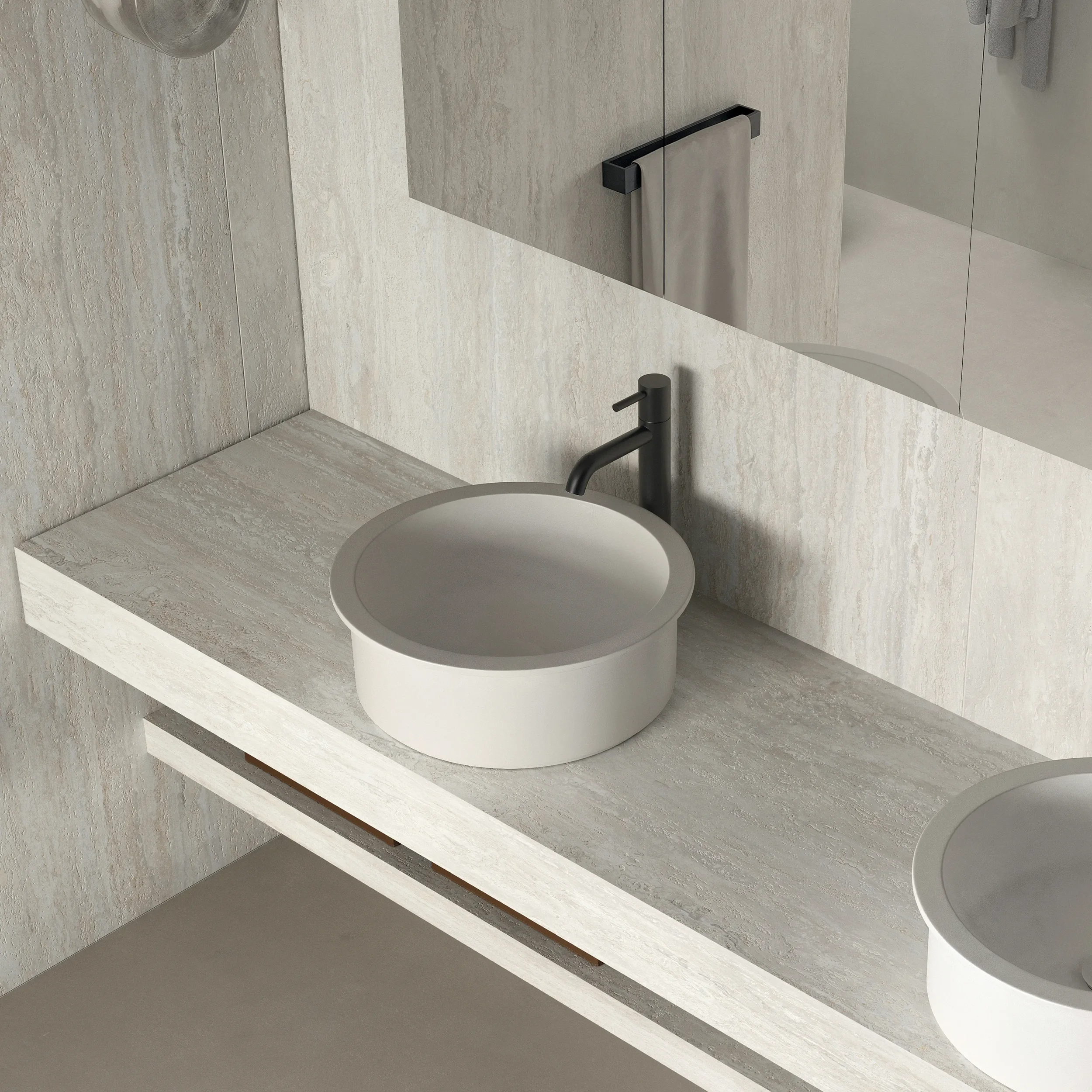 Modern vessel basin from the LOOM collection by Italgraniti Group, featuring a matte white finish paired with a sleek, black countertop tap, available through PietraCasa.