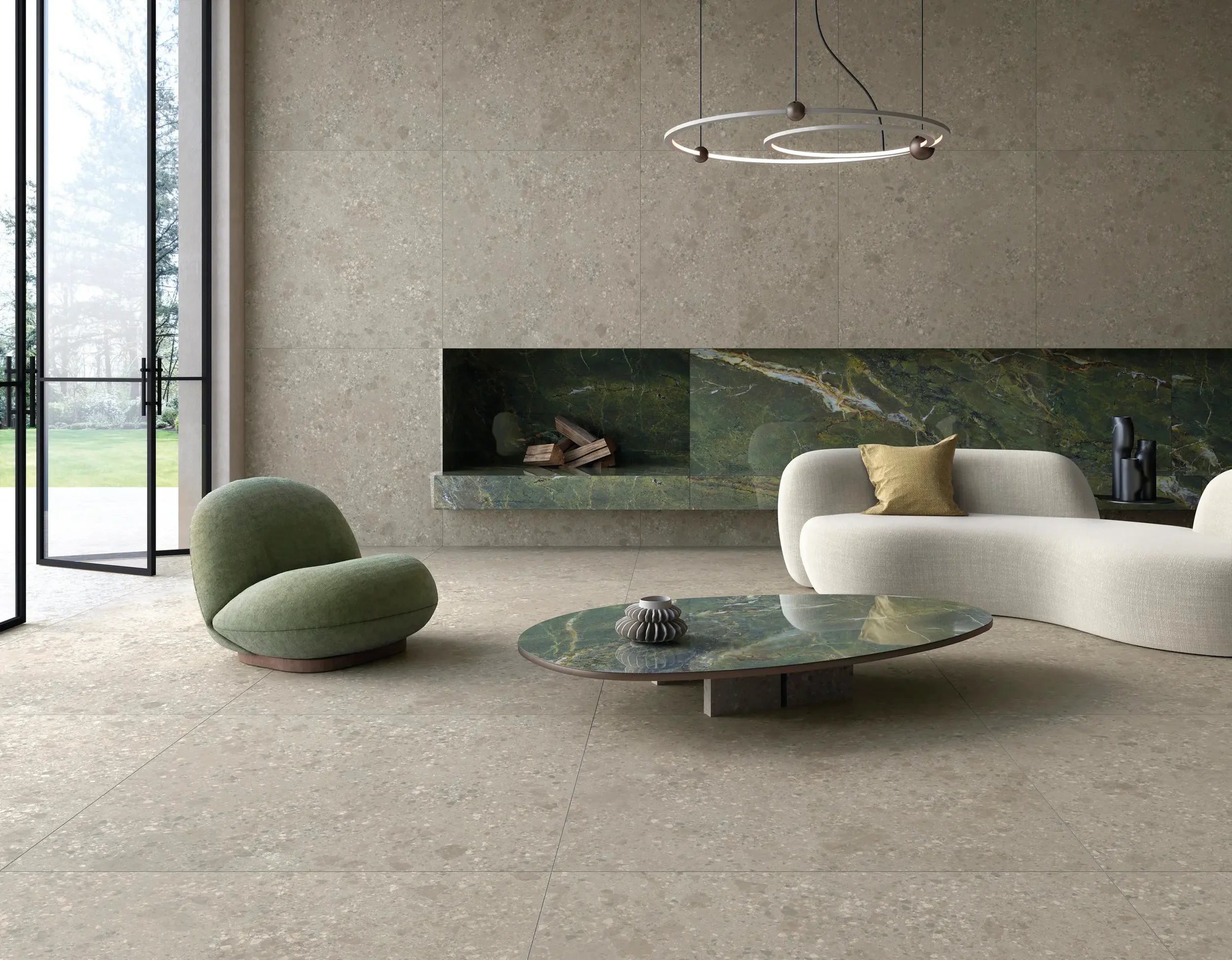 Modern living room interior featuring Ariostea Fragmenta full-body porcelain stoneware flooring and wall cladding, supplied and installed nationwide by PietraCasa.