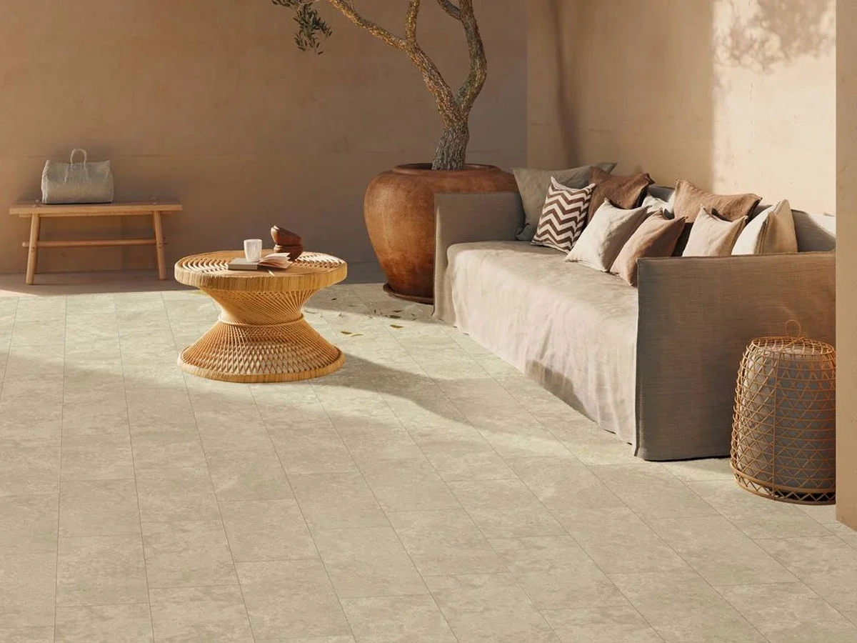 Outdoor terrace featuring Supergres Forth collection porcelain stoneware tiles in Chianca, designed for seamless indoor and outdoor use, supplied by PietraCasa.