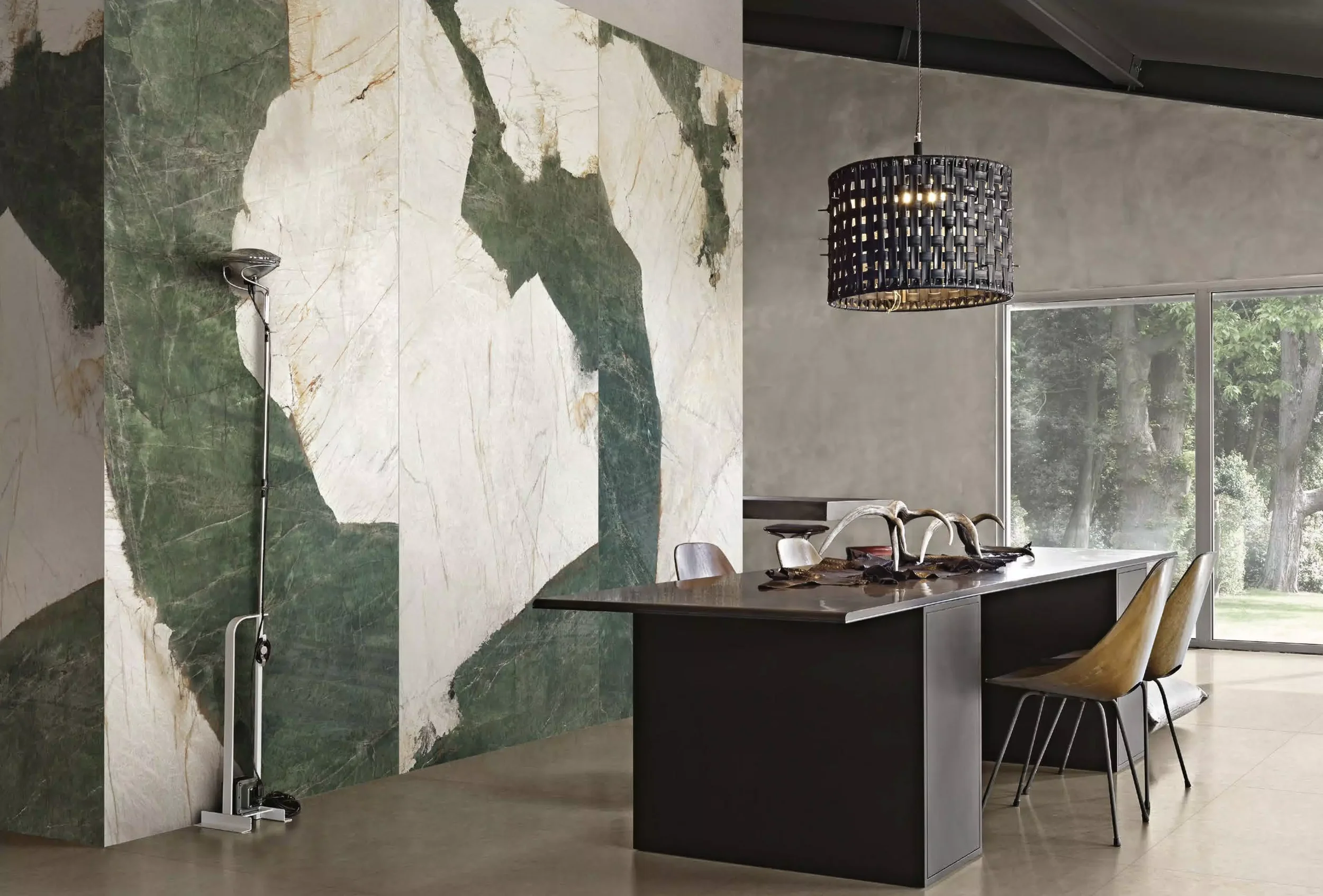 Elegant interior space featuring a stunning accent wall with Florim Heritage Aqua porcelain tiles, celebrated for their dramatic green and white marble effect, expertly supplied and installed by PietraCasa.