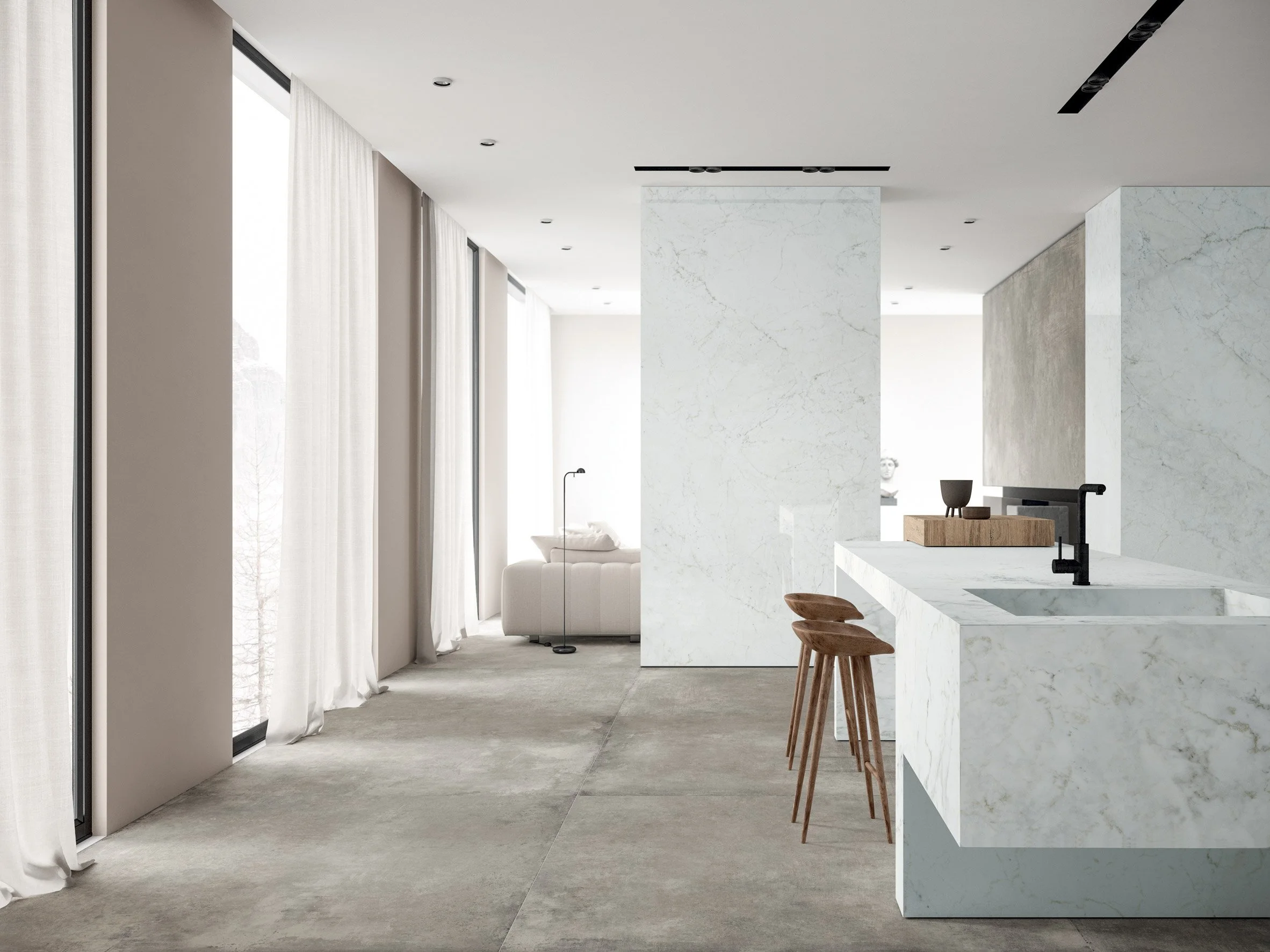 Modern open-plan interior featuring Ariostea Ultra Marmi Michelangelo Altissimo porcelain stoneware slabs on the kitchen island and wall cladding, supplied and installed nationwide by PietraCasa.