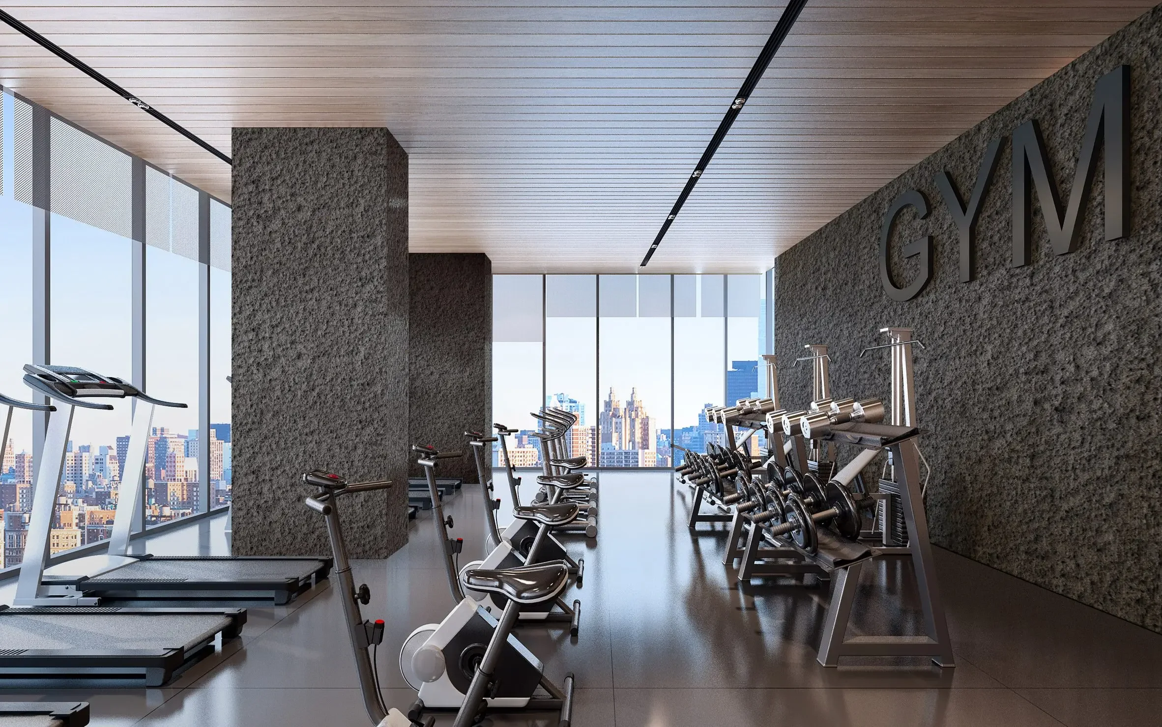 Luxury fitness room design featuring textured accent walls and heavy pillars inspired by signature natural stone slabs from Antolini Italy, supplied by PietraCasa.