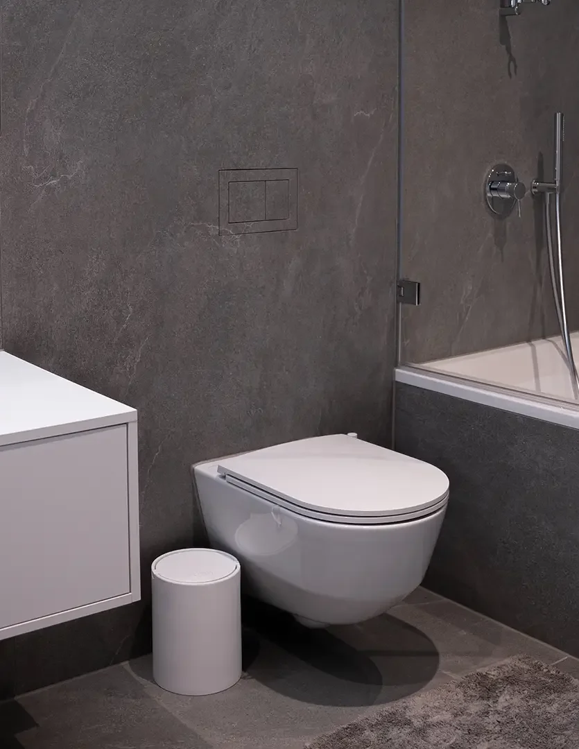 Modern, wall-hung toilet design featuring a hidden flush system by innovative bathroom brand Clanea, professionally supplied and installed by PietraCasa.