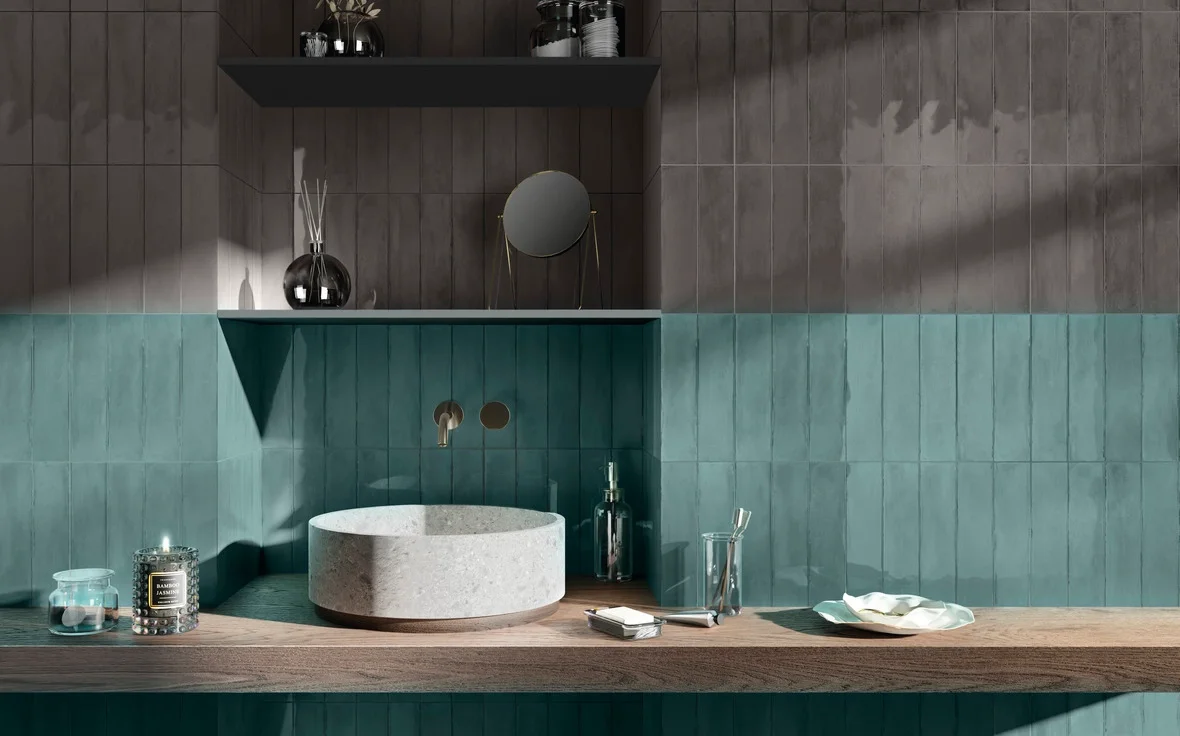 Modern vanity space featuring Iris Ceramica wall tiles in Acquamarina glossy and Carbone glossy, showcasing handmade-look rectangular tiles that bring depth and a vibrant, aquatic feel to the design, available through PietraCasa.