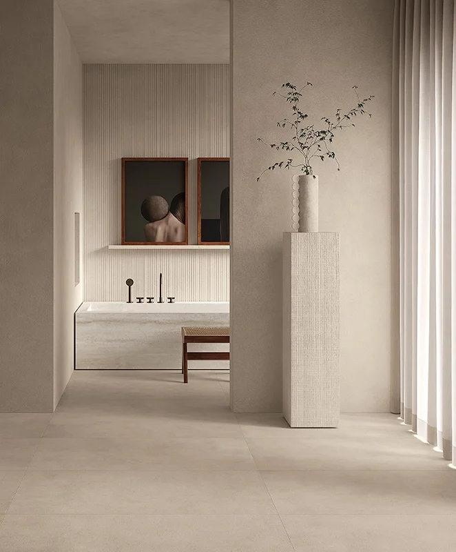 An elegant, minimalist spa-style bathroom showcasing the Materia collection by Kronos Ceramiche, featuring sophisticated, high-end concrete-effect porcelain stoneware, available through PietraCasa.