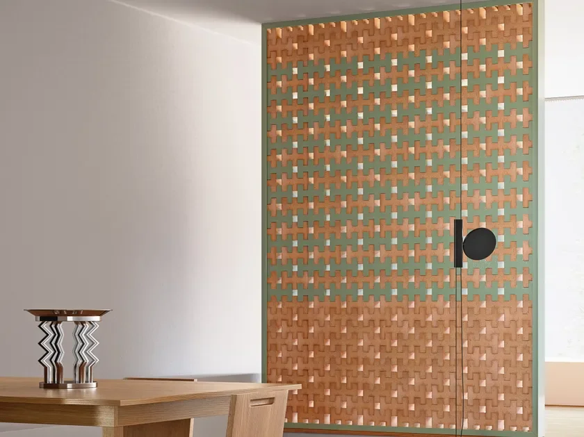Modern room divider installation using Mutina Brac 3D terracotta bricks designed by Nathalie Du Pasquier, creating a patterned architectural screen, available through PietraCasa.