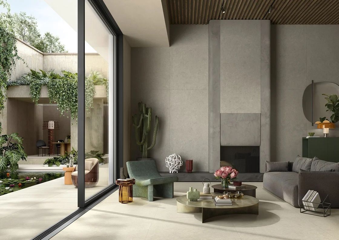 A modern lounge featuring a seamless indoor-outdoor aesthetic, showcasing the Intense porcelain stone-look collection by Lea Ceramiche, available through PietraCasa