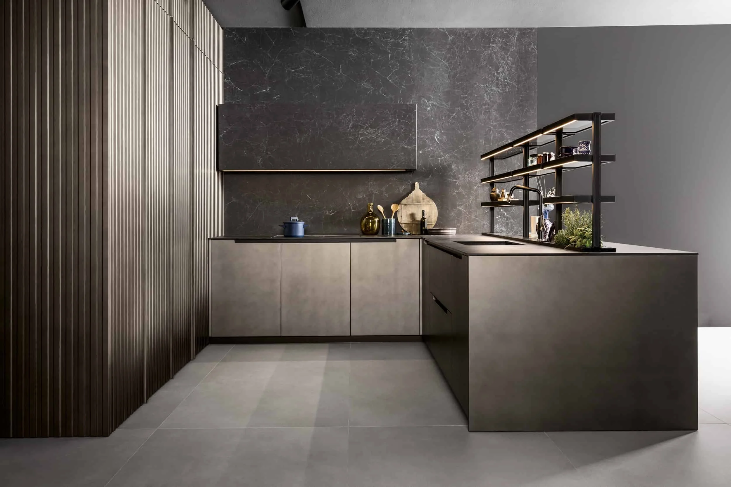 A modern minimalist space featuring a Mittel Cucine custom kitchen design with premium Laminam large-format porcelain surfaces, available through PietraCasa.