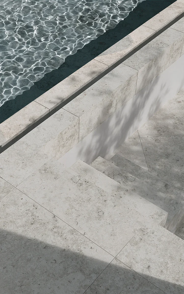 An outdoor pool deck featuring the Kendo Light porcelain collection by Living Ceramics, available through PietraCasa.