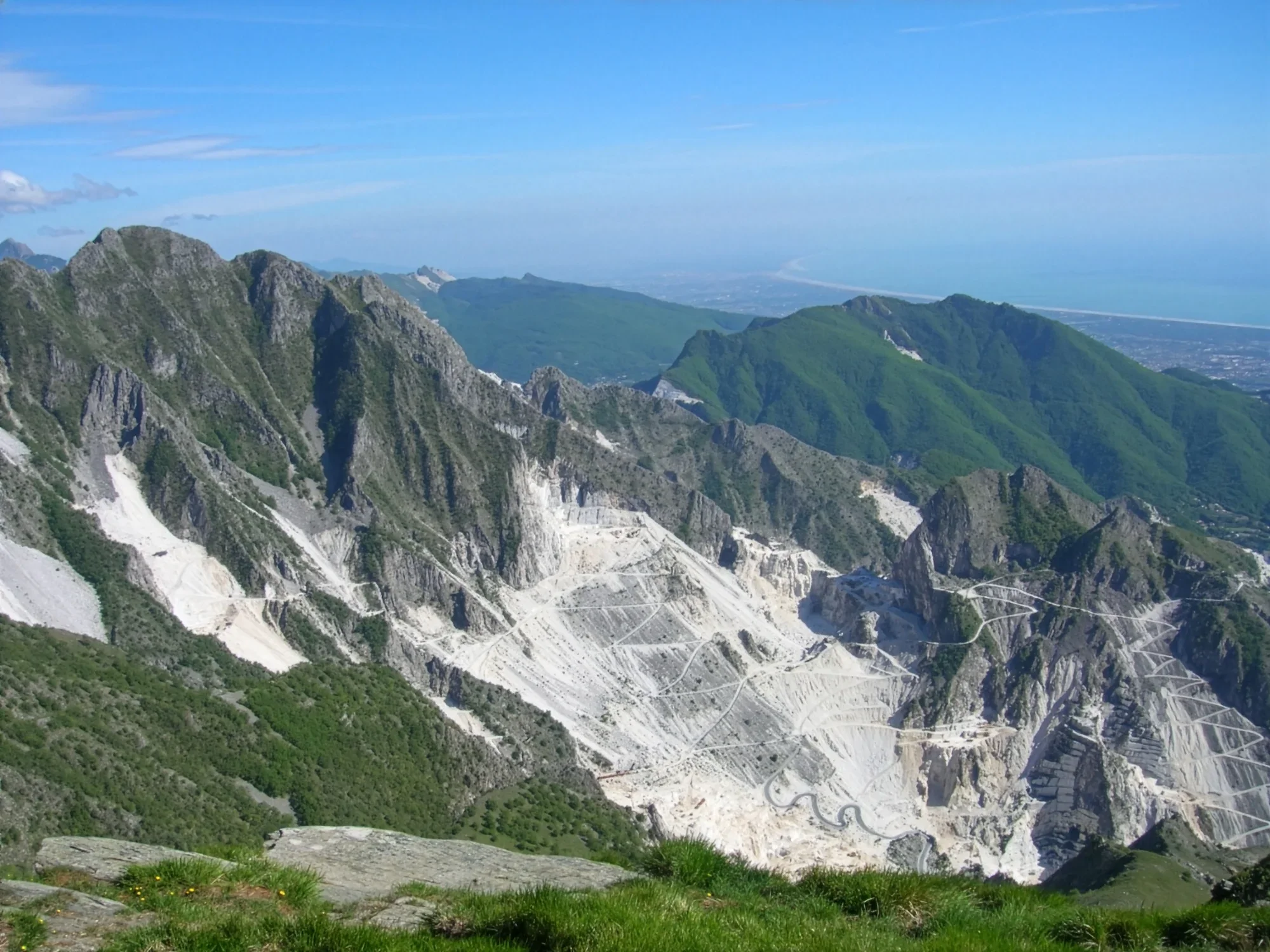 The Apuan Alps quarries, representing the foundation of Luce di Carrara's design philosophy, where natural stone is transformed into refined structural sculpture, available through PietraCasa.