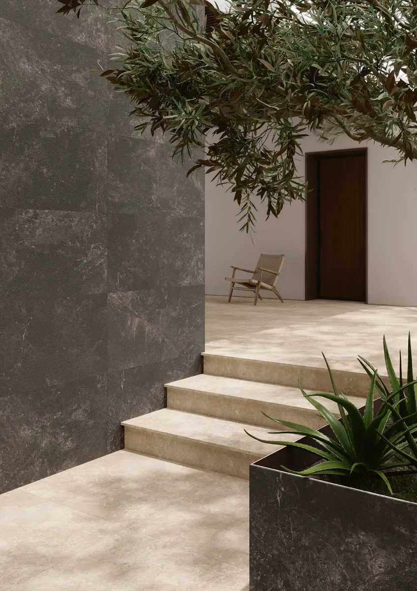 Modern outdoor terrace featuring Ariostea CM2 Twin.S Anise porcelain stoneware slabs with a concrete effect, supplied and installed nationwide by PietraCasa.