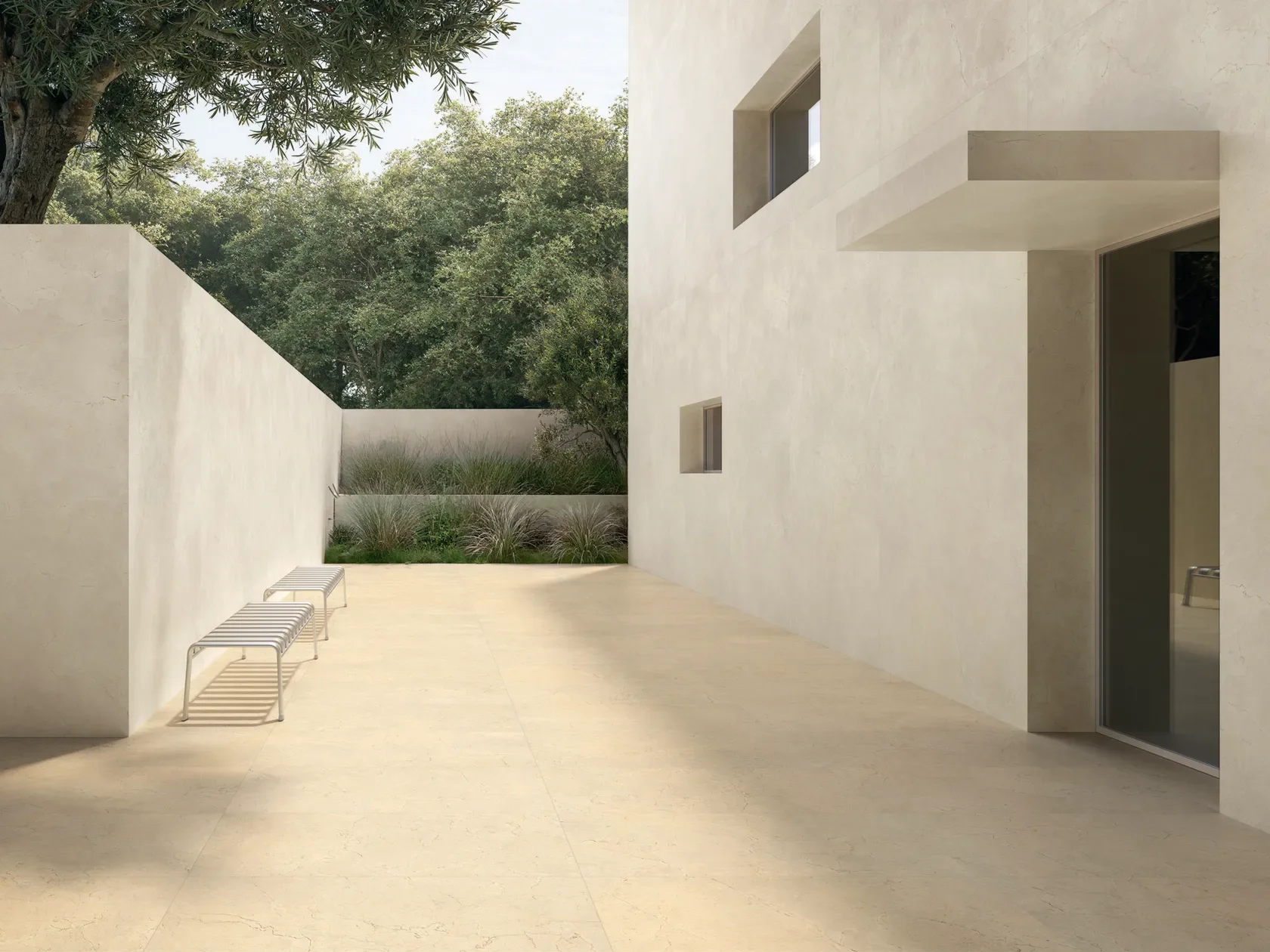 Modern exterior space featuring high-performance porcelain paving slabs from Italstone, suitable for seamless indoor-outdoor transitions, available through PietraCasa.