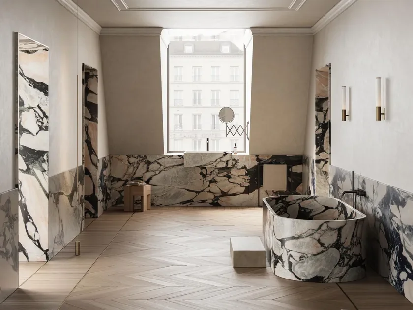 Luxurious bathroom featuring Margraf Notre-Dame marble, a rare stone distinguished by a crisp white background and dramatic charcoal and blush-pink veins, supplied by PietraCasa