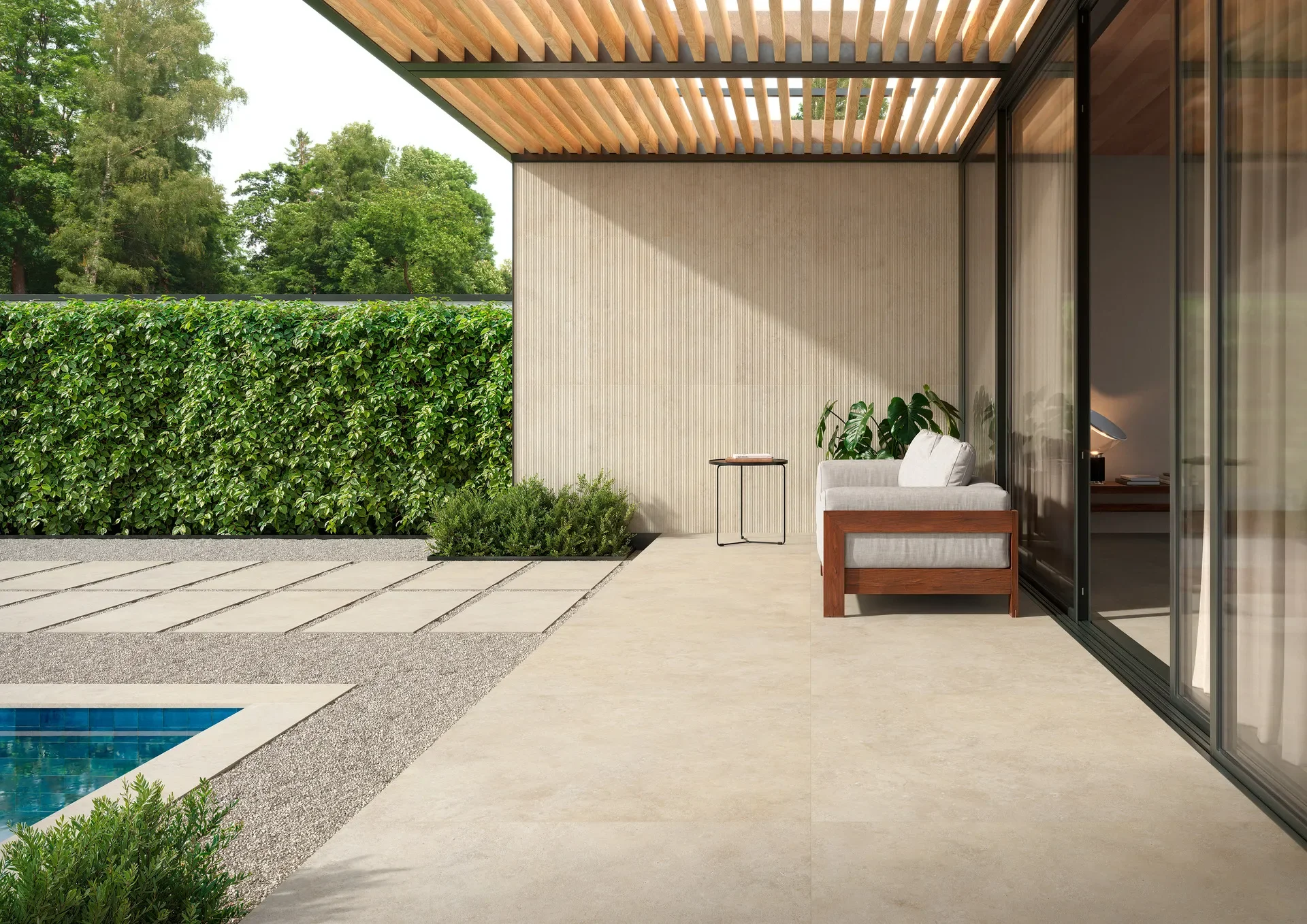 Luxurious patio featuring ultra-durable Marazzi Mystone Tivoli20 porcelain stoneware tiles, designed to seamlessly connect indoor and outdoor environments with a slip-resistant surface, available through PietraCasa.